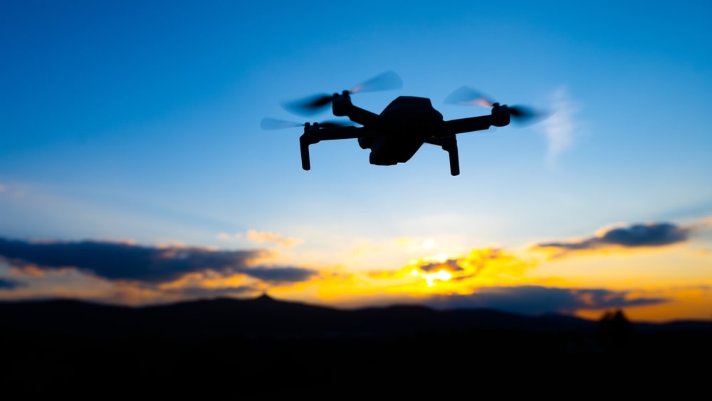 uav silhouette in sunset sky